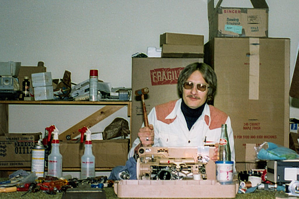 Jerome Most at the Repair Bench inside Fremont Sewing Center. Early 1980s