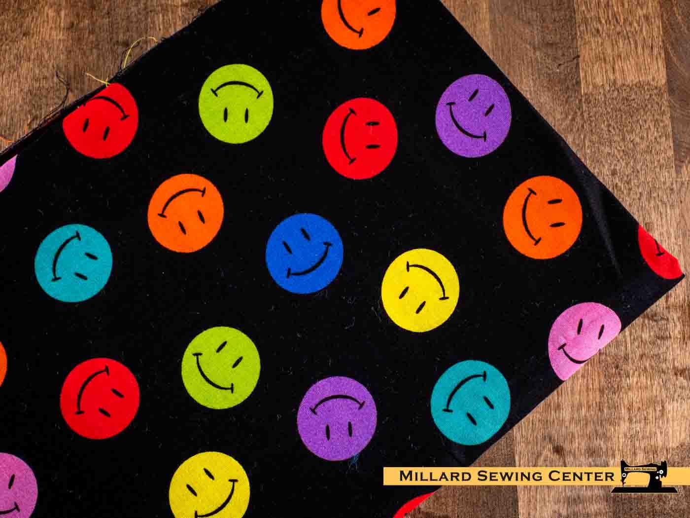 Remnant (Cotton) Black with Colorful Smiley Faces Print Fabric (32")