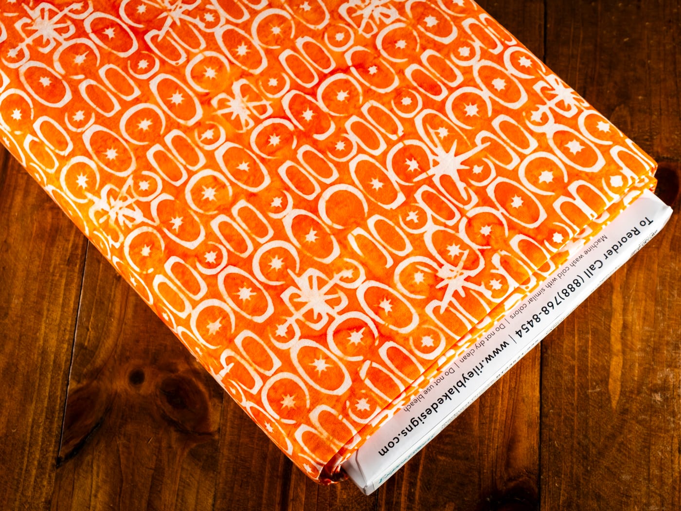 Cotton Fabric, 43"/44" Wide Batiks in Starburst Groove Tangerine by Riley Blake