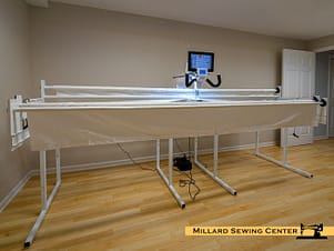 Janome Quilt Maker 18 shown with Optional QF01502-JA 2 Foot Extension and Quilting Robot.