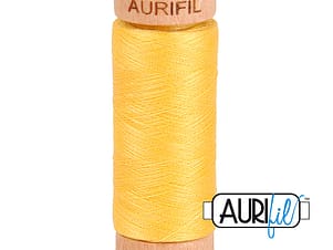 80wt Cotton Thread in 1135 Pale Yellow by Aurifil