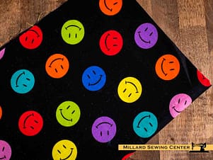 Remnant (Cotton) Black with Colorful Smiley Faces Print Fabric (32")