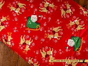 Cotton Fabric, 43"/44" Wide Flannel The North Pole in Reindeer Toss Tomato by Riley Blake