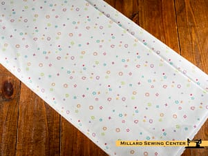 Cotton Fabric, 43"/44" Wide Chasing Rainbows in Garden Sprinkles White by Riley Blake