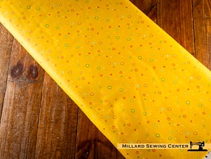 Cotton Fabric, 43"/44" Wide Chasing Rainbows in Garden Sprinkles Daffodil by Riley Blake
