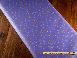 Cotton Fabric, 43"/44" Wide Chasing Rainbows in Garden Sprinkles Purple by Riley Blake