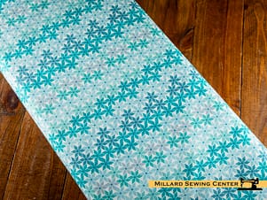 Cotton Fabric, 43"/44" Wide Chasing Rainbows in Stellar Weave Aqua by Riley Blake
